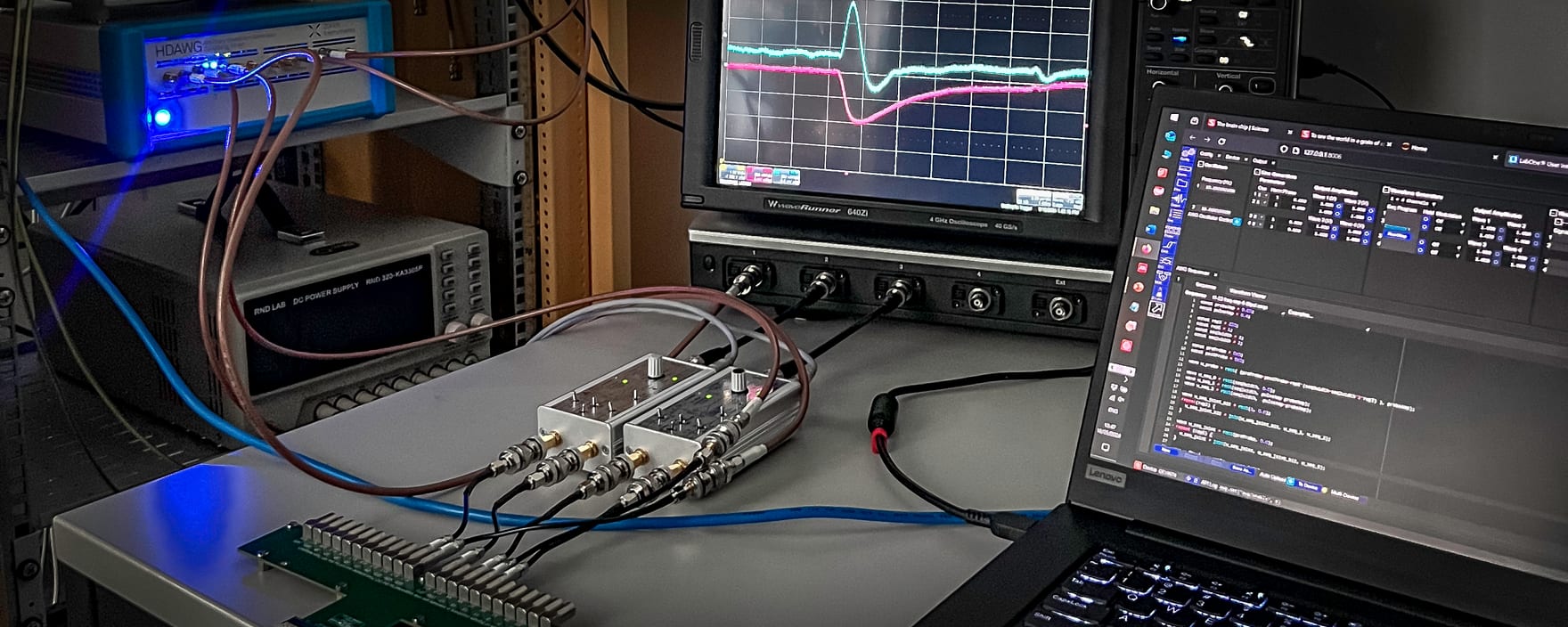 The automated DC/RF characterization bench — oscilloscope, arbitrary-waveform generator, custom fixtures and Python control.